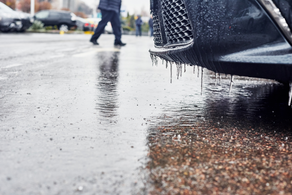 Person walking in an icy parking lot