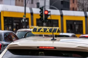 Taxicab on street with Taxi sign on its roof